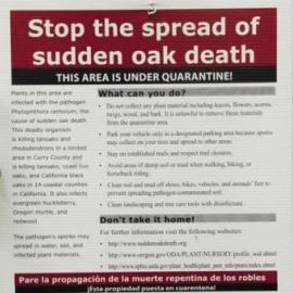 Sign saying "Stop the spread of sudden oak death"