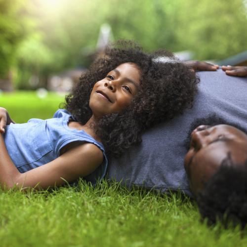 People laying on lawn