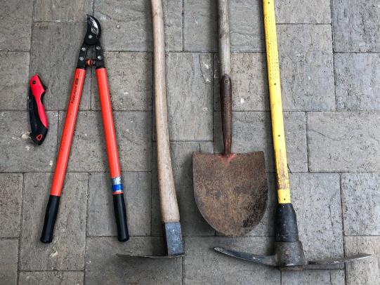A selection of hand tools for removing broom plants